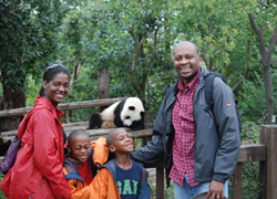 Family Photo With Panda Eating At Back 