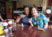 Sarah and her friend are tasting tea.
