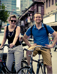 Sweet couple biking in Shanghai