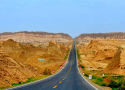 Highway traverses the Tanklamagan Desert